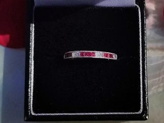 Ruby and diamond half eternity ring